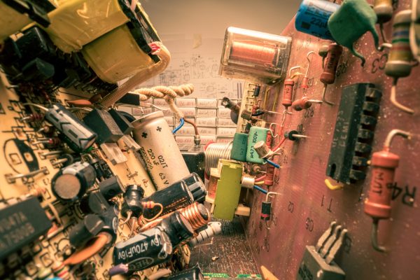 Retro electronics workshop. with parts, soldering iron and voltmeter. Old fashioned crafts.